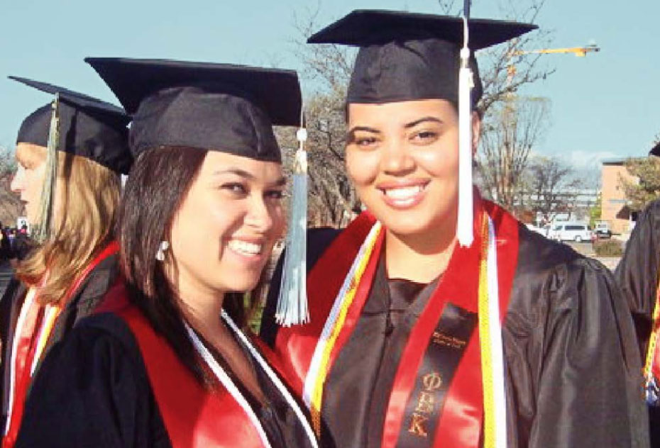 Vanessa smiling on graduation day with one of her classmates